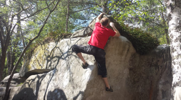 Advanced climbing technique: rocking over on a blank wall to exploit the normal force to gain friction.